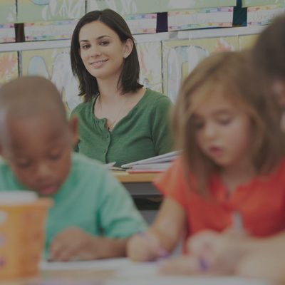 Teacher watching students take test