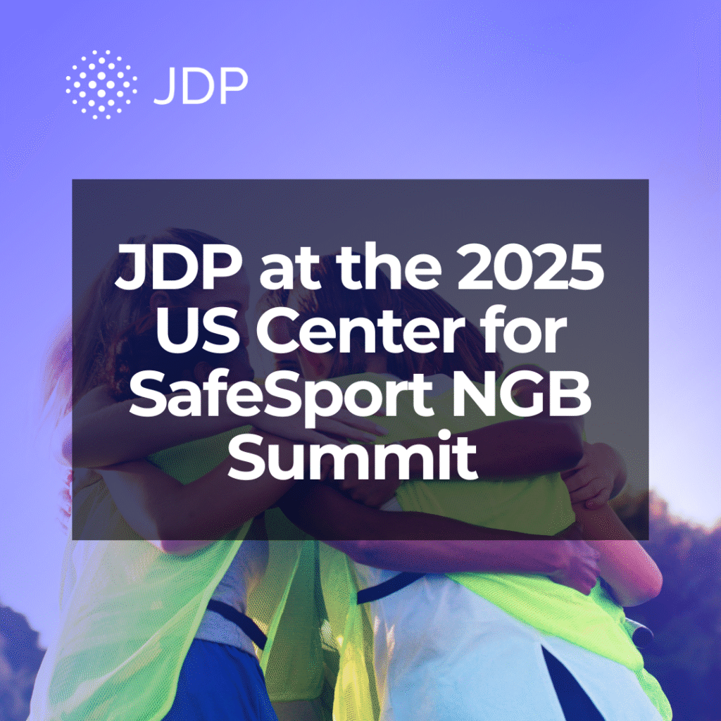 Youth soccer athletes huddled up.