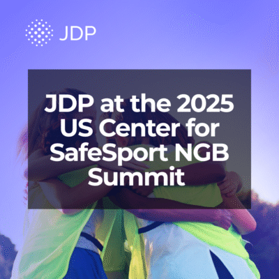 Youth soccer athletes huddled up.